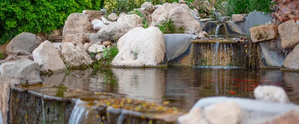 Natural rock pond with cascading waterfalls